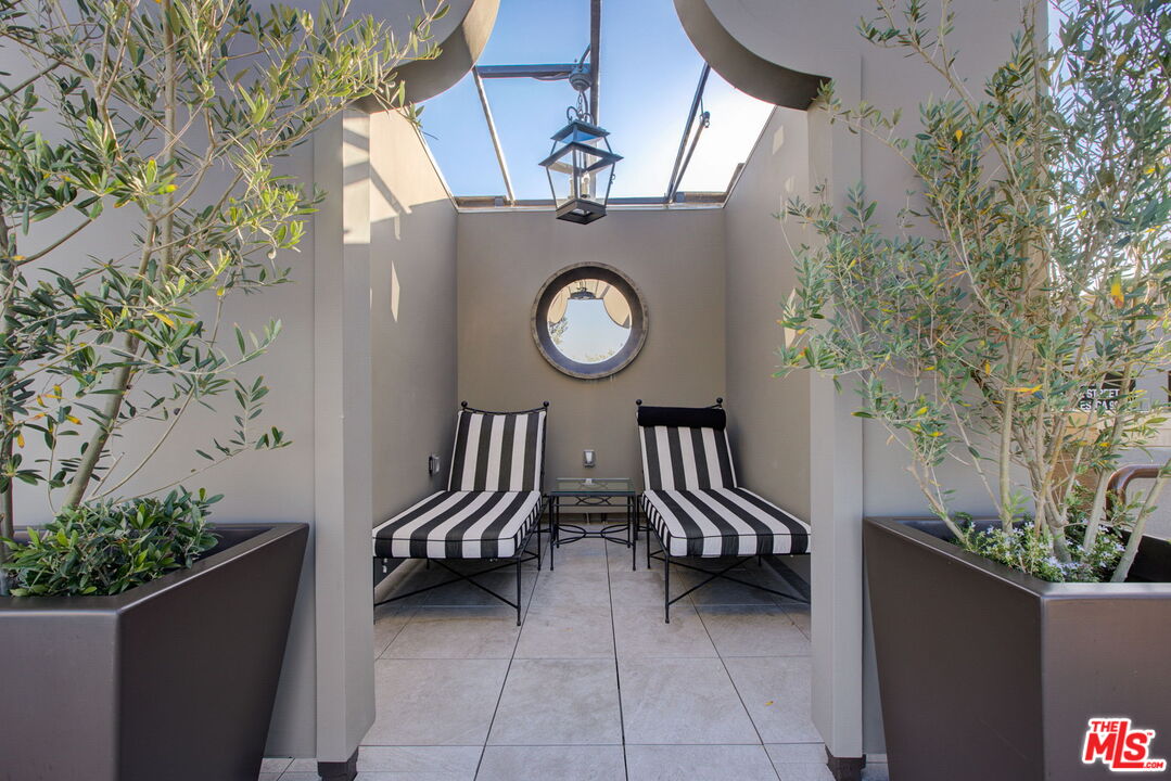 1645 Vine Street, Unit 908 Los Angeles, CA 90028 - Photo 41 of 52 a view of outdoor space and porch with furniture