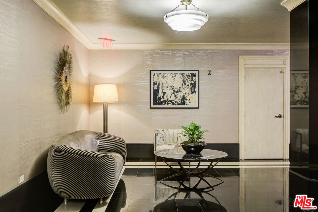 1645 Vine Street, Unit 908 Los Angeles, CA 90028 - Photo 8 of 52 a lamp room with furniture and wooden floor