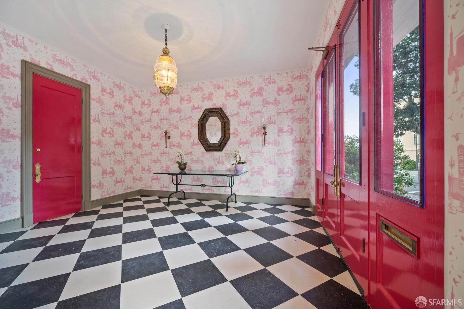 a living room with a black white checkered floor with a black white checkered floor and a rug