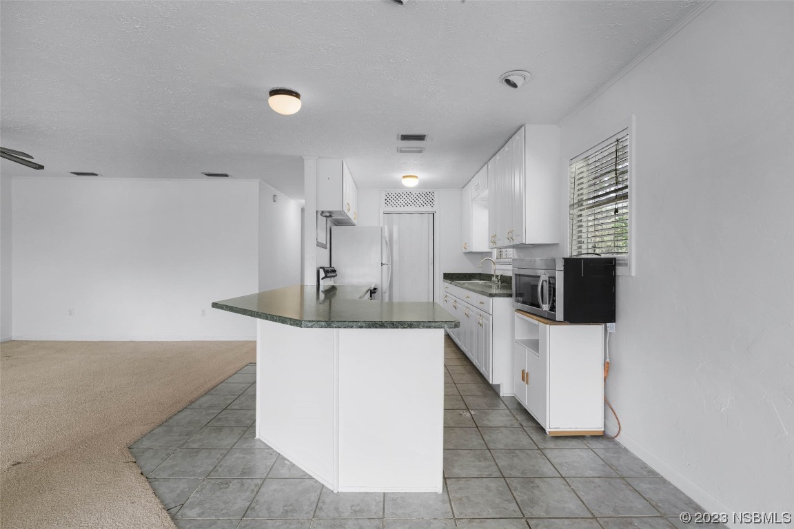486 Detroit Terrace DeBary, FL 32713 - Photo 19 of 47 a kitchen with stainless steel appliances a refrigerator sink and stove