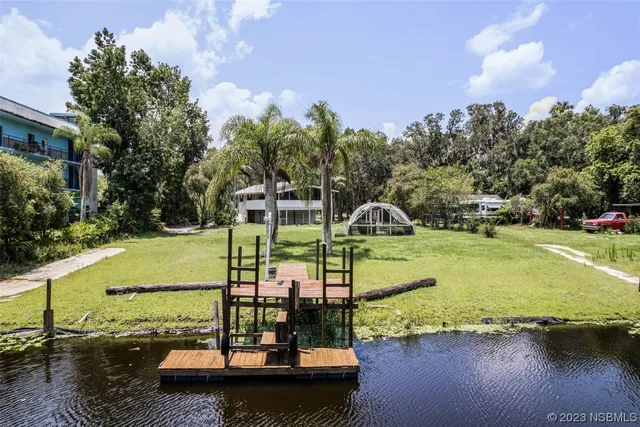a view of a lake with a yard