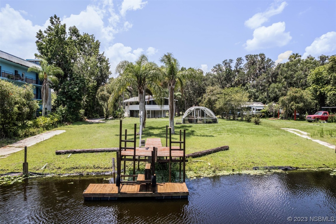 486 Detroit Terrace DeBary, FL 32713 - Photo 2 of 47 a view of a lake with a yard