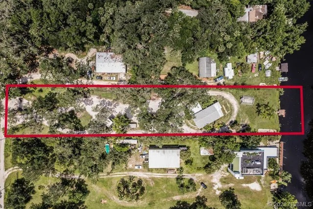 a view of a lake with a yard