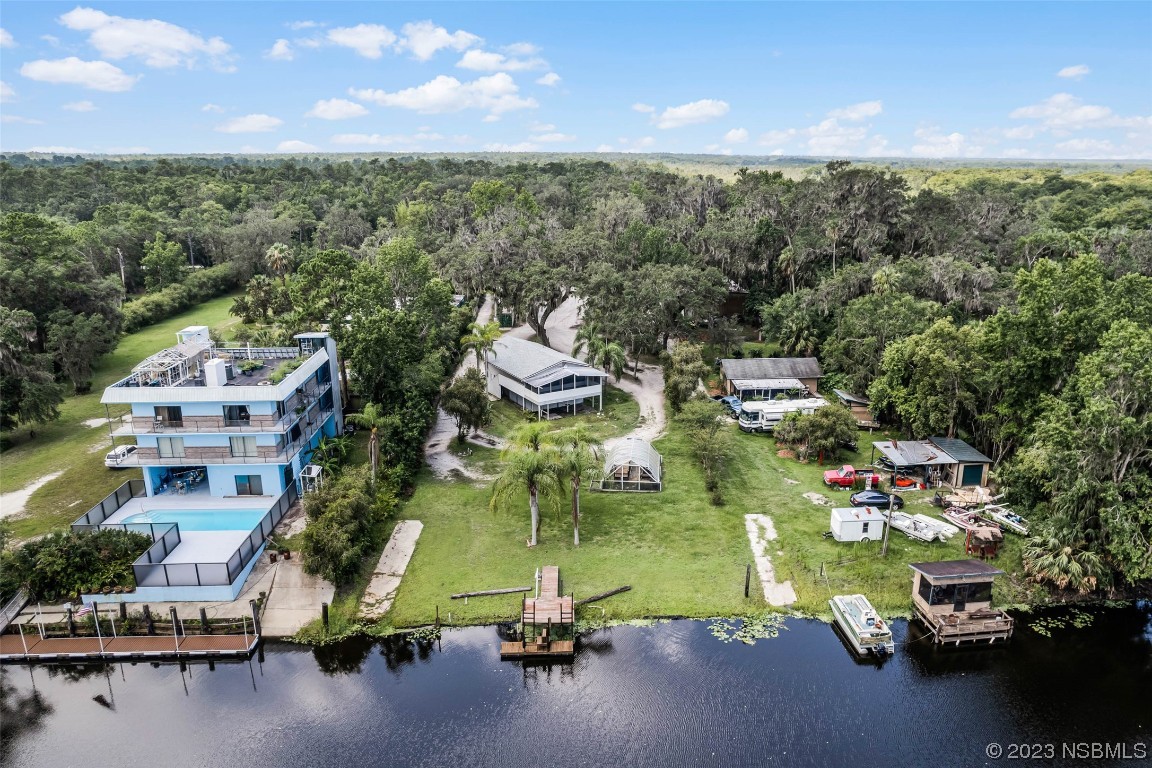 486 Detroit Terrace DeBary, FL 32713 - Photo 4 of 47 a view of a lake with a houses