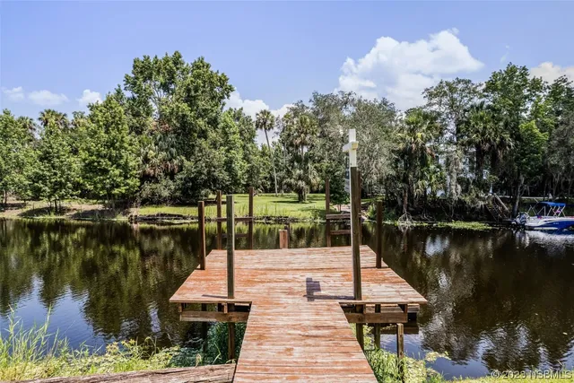 a view of a lake with sitting area