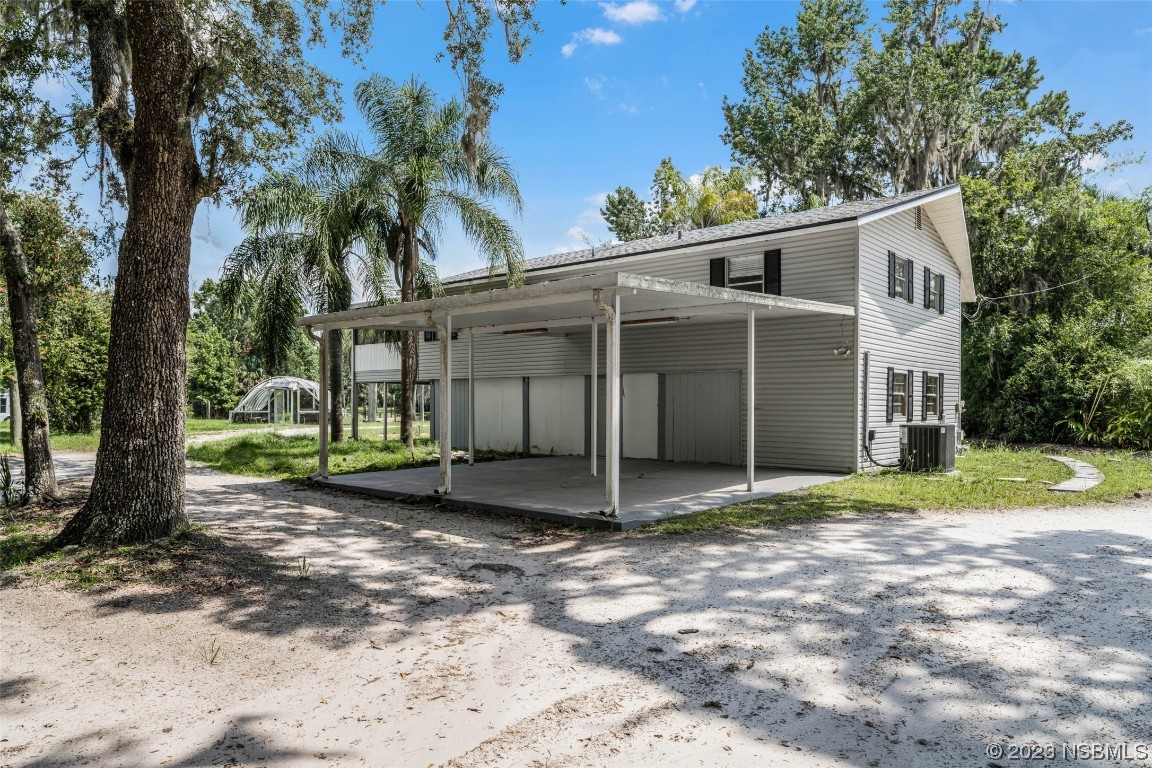 486 Detroit Terrace DeBary, FL 32713 - Photo 8 of 47 a view of a house with a yard and large tree