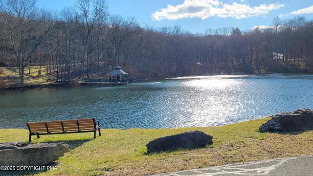 a picture of a bench in front of a wall