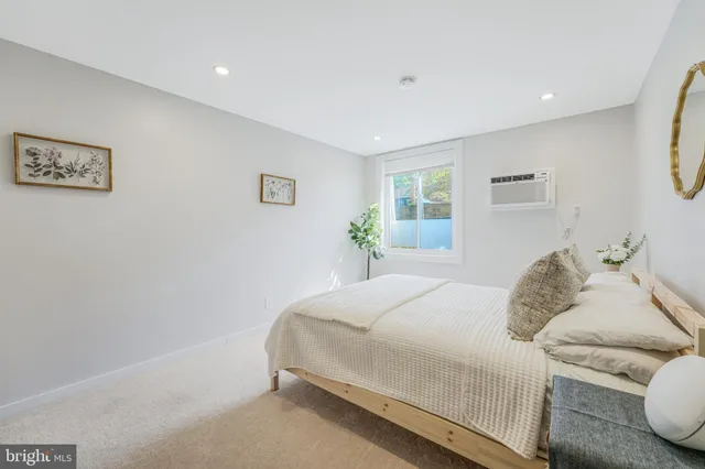 a bedroom with a bed and a couch