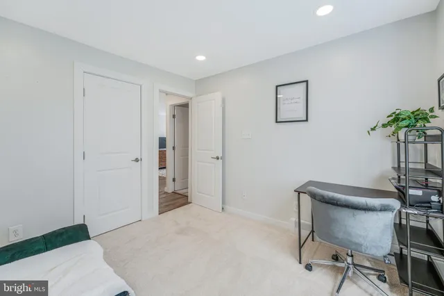 a livingroom with a workspace