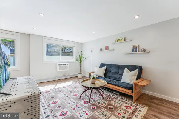 a living room with furniture and a window