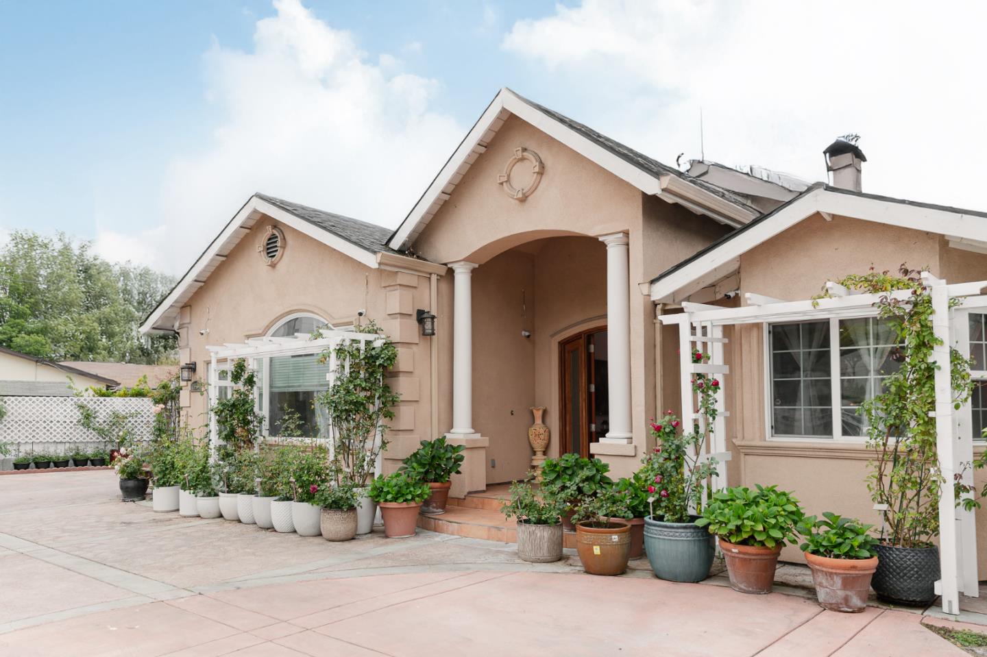 1837 South White Road San Jose, CA 95127 - Photo 1 of 1 a view of a white house with potted plants