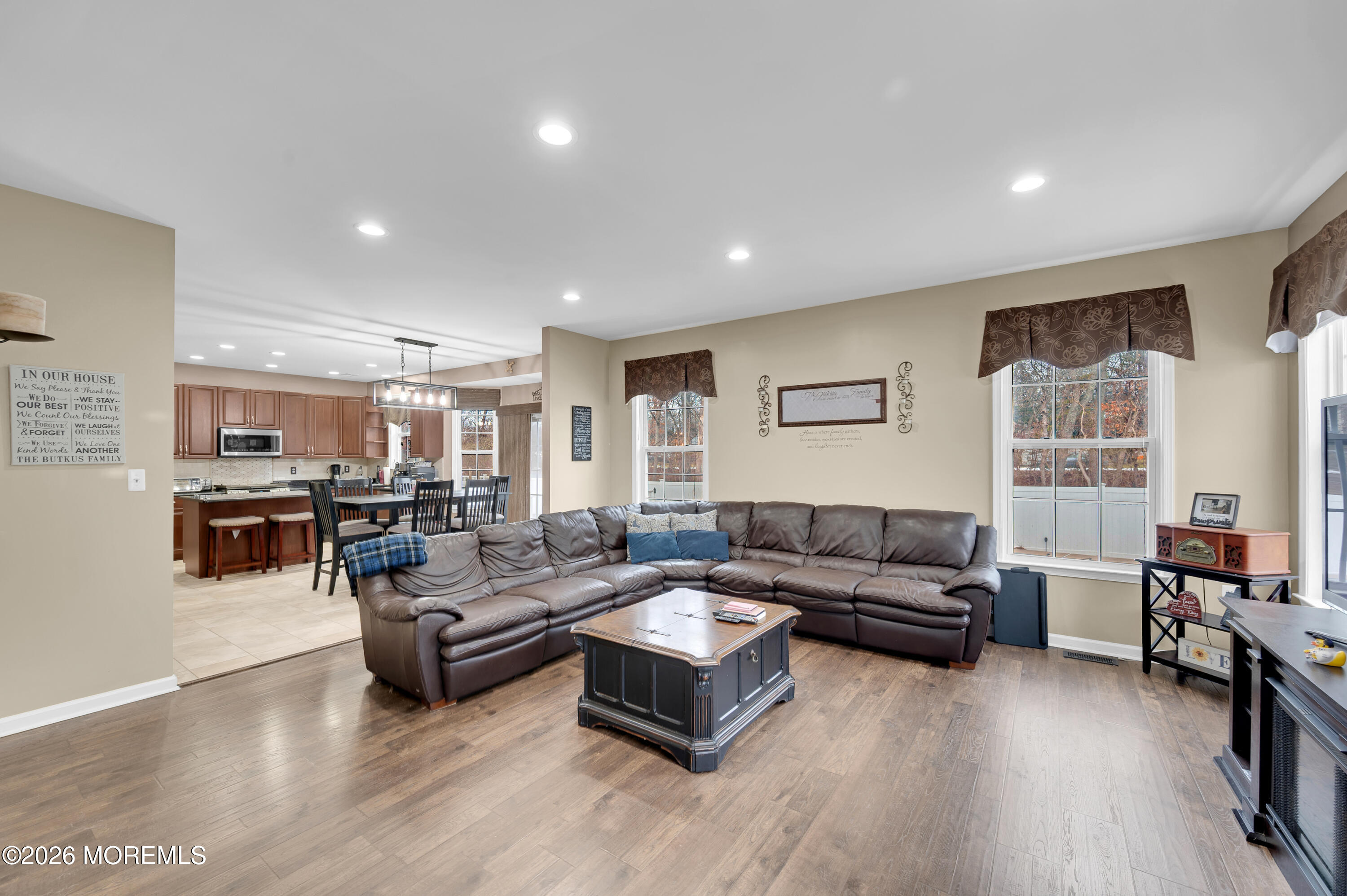 6 Reuben Court Howell, NJ 07731 - Photo 11 of 66 a living room with furniture wooden floor and a large window