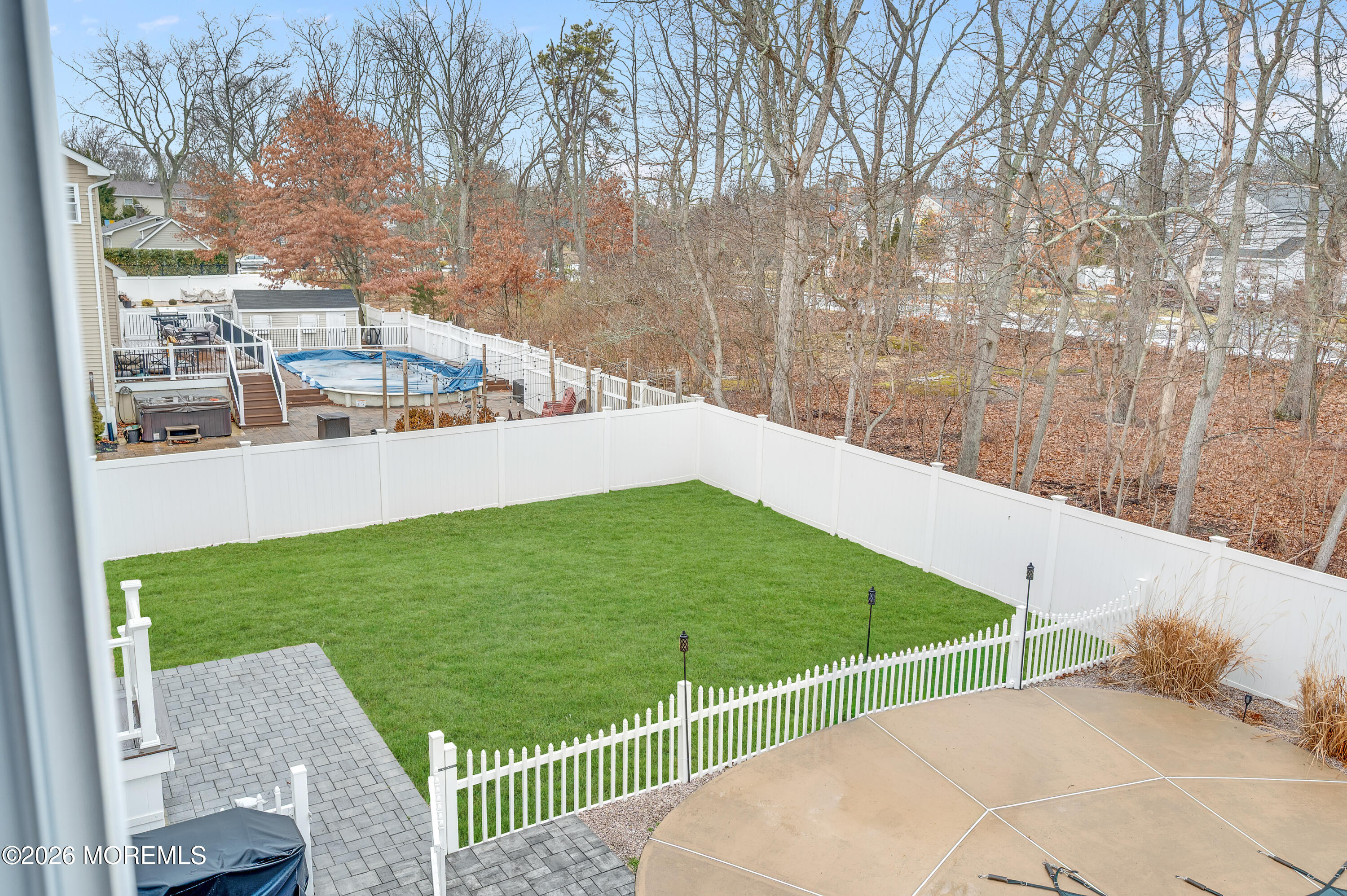 6 Reuben Court Howell, NJ 07731 - Photo 14 of 66 a view of a backyard and floor