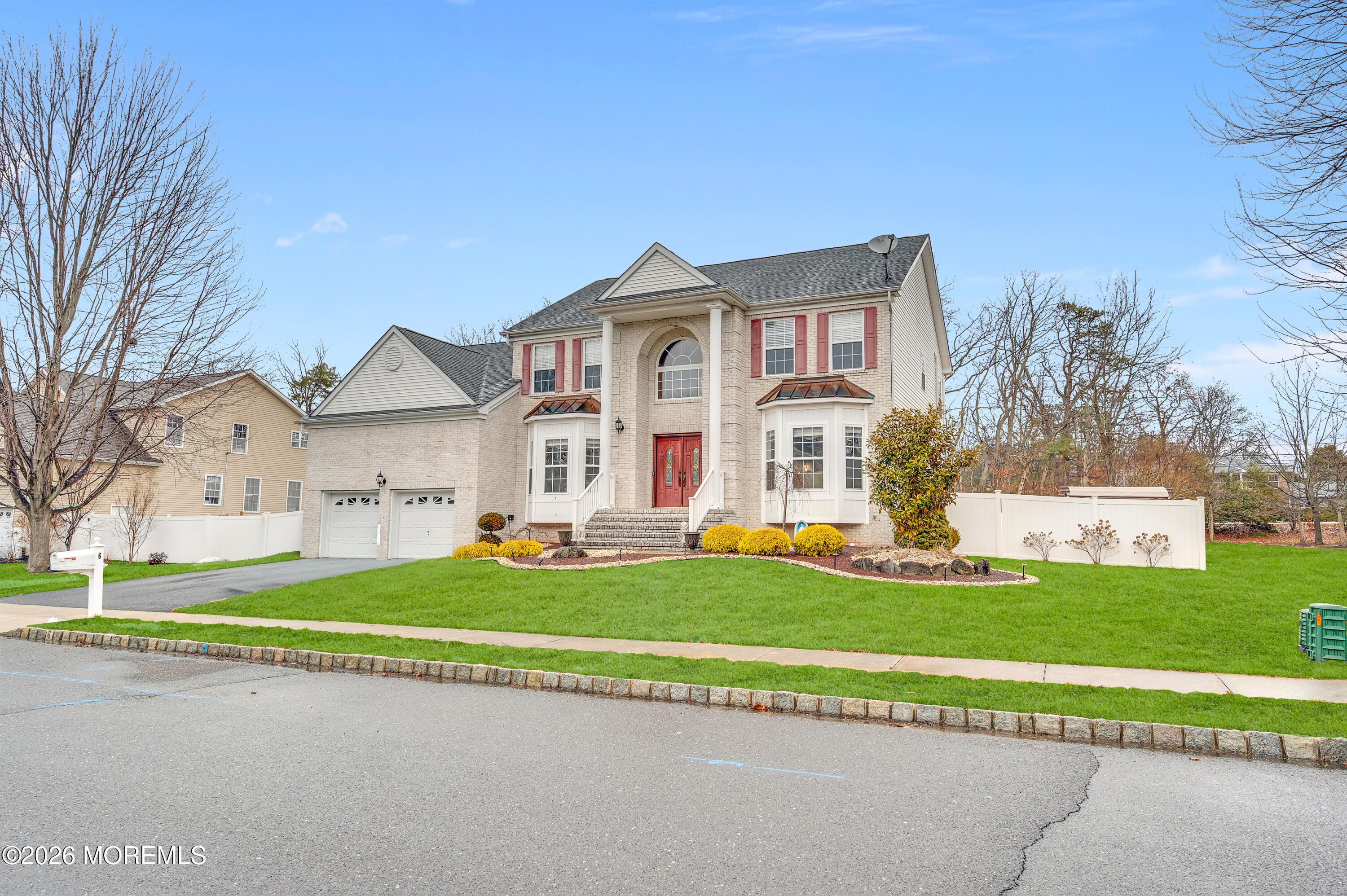 6 Reuben Court Howell, NJ 07731 - Photo 19 of 66 a view of a white house with a big yard and large trees