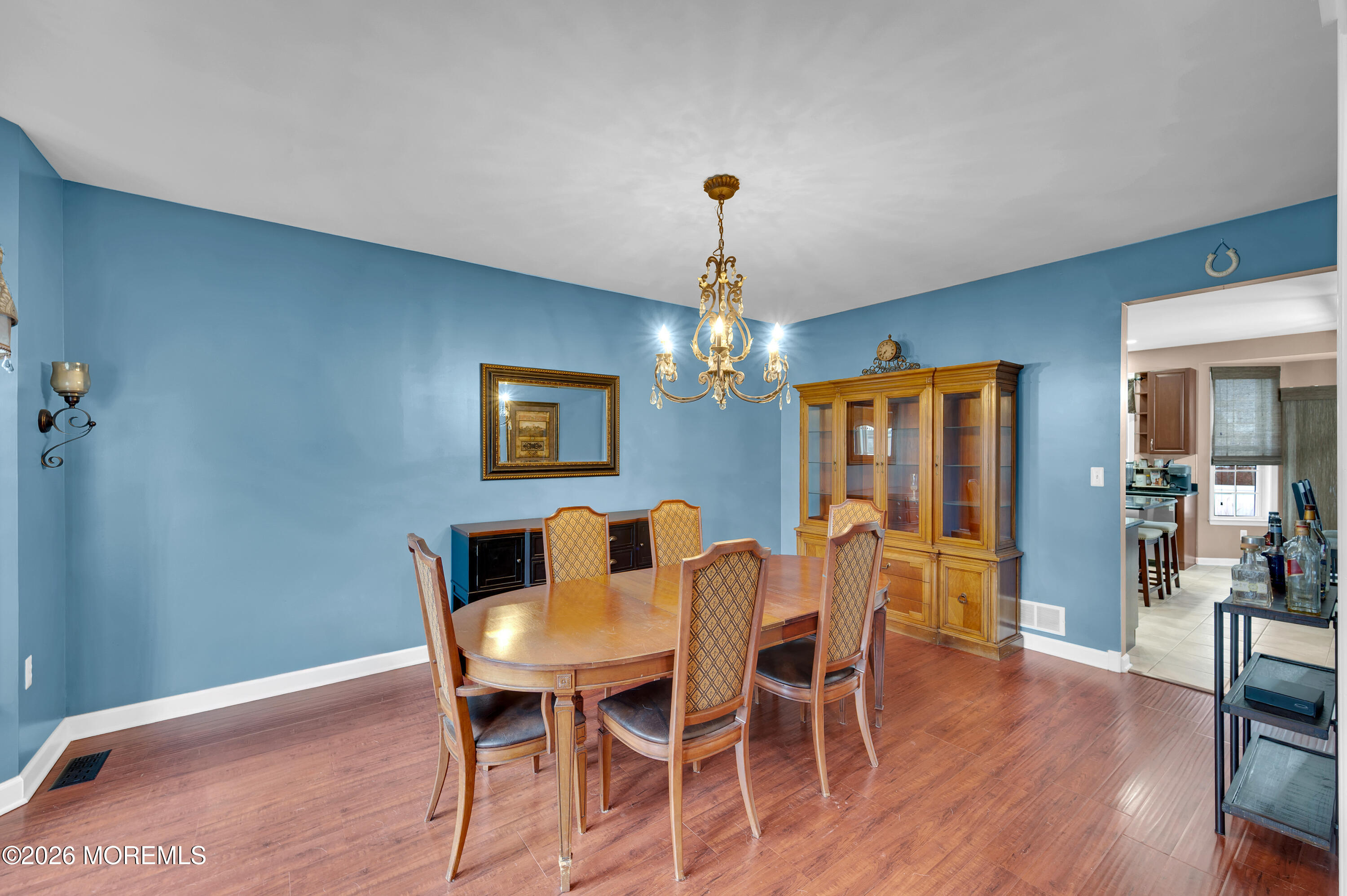 6 Reuben Court Howell, NJ 07731 - Photo 21 of 66 a view of a dining room with furniture and wooden floor