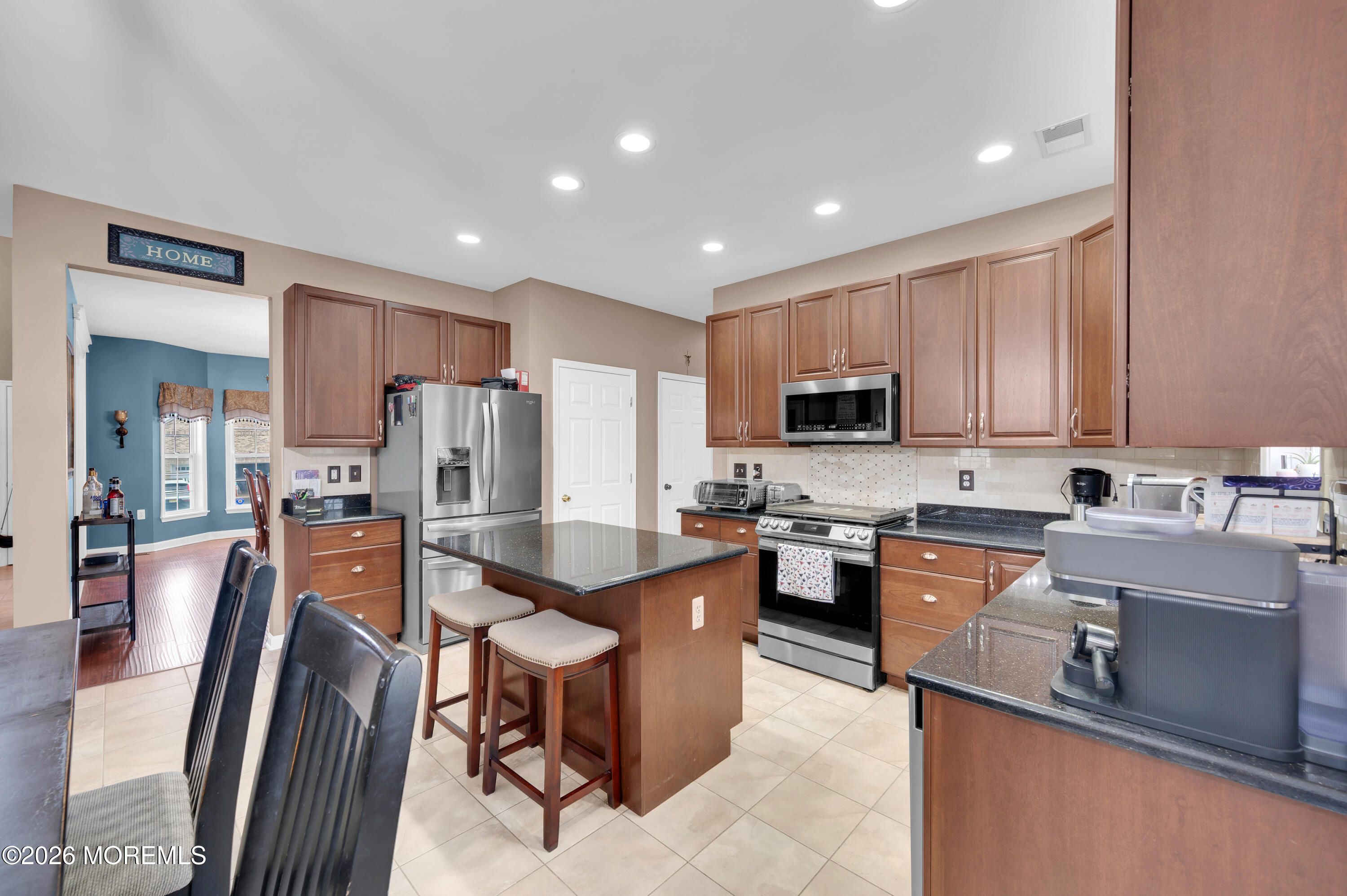 6 Reuben Court Howell, NJ 07731 - Photo 23 of 66 a large kitchen with stainless steel appliances lots of counter top space