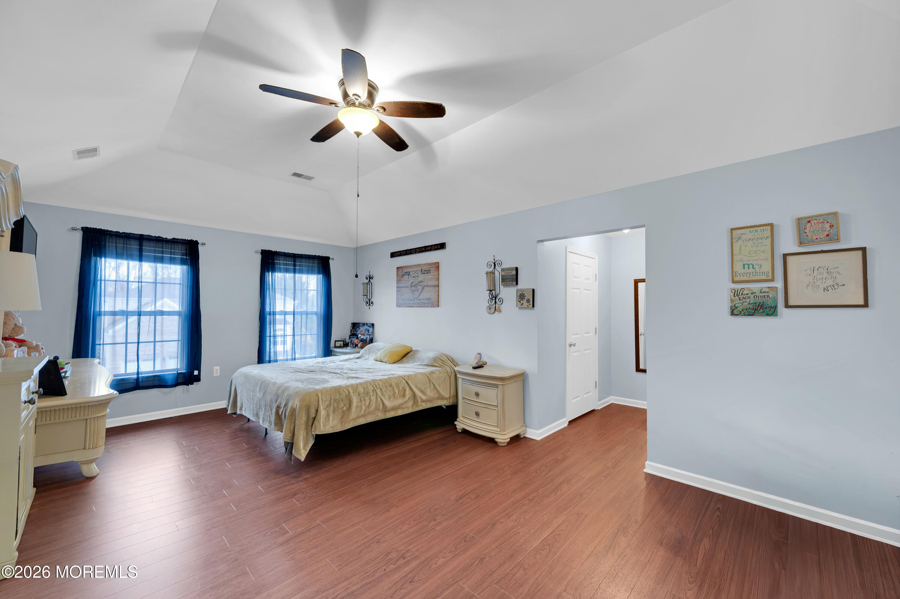 6 Reuben Court Howell, NJ 07731 - Photo 29 of 66 a spacious bedroom with a bed and a chandelier
