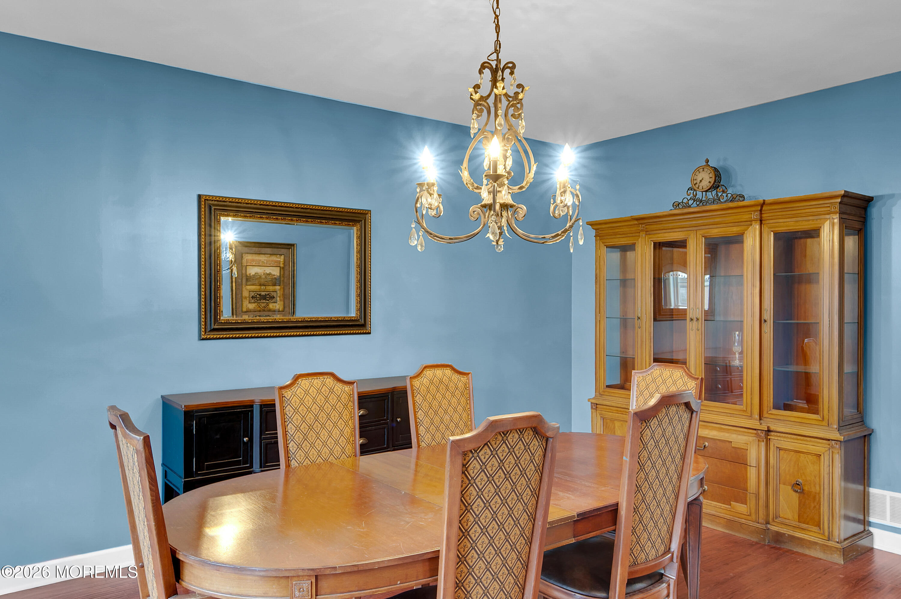 6 Reuben Court Howell, NJ 07731 - Photo 4 of 66 a view of a dining room with furniture wooden floor and chandelier