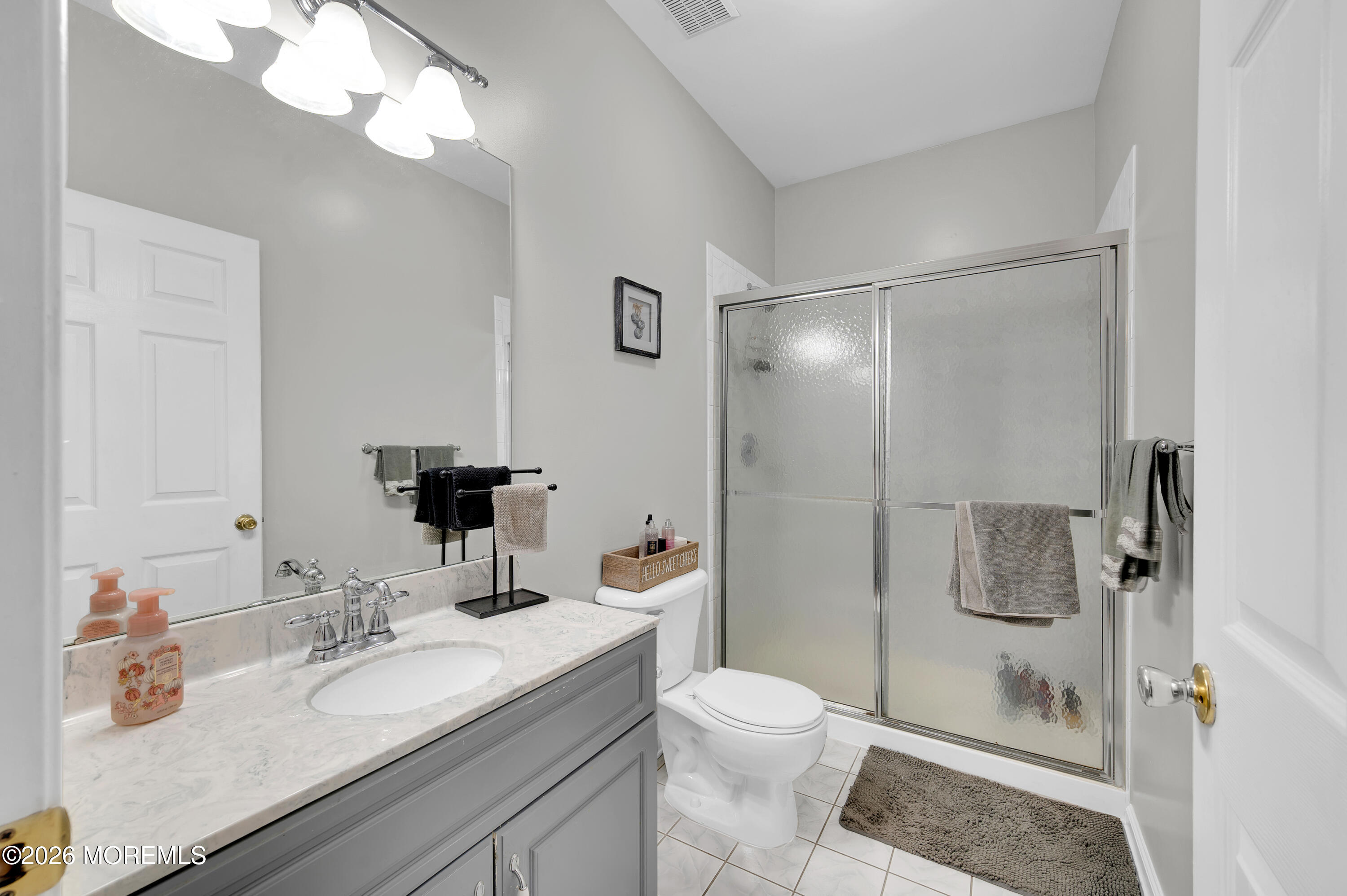 6 Reuben Court Howell, NJ 07731 - Photo 56 of 66 a bathroom with a sink a toilet and shower