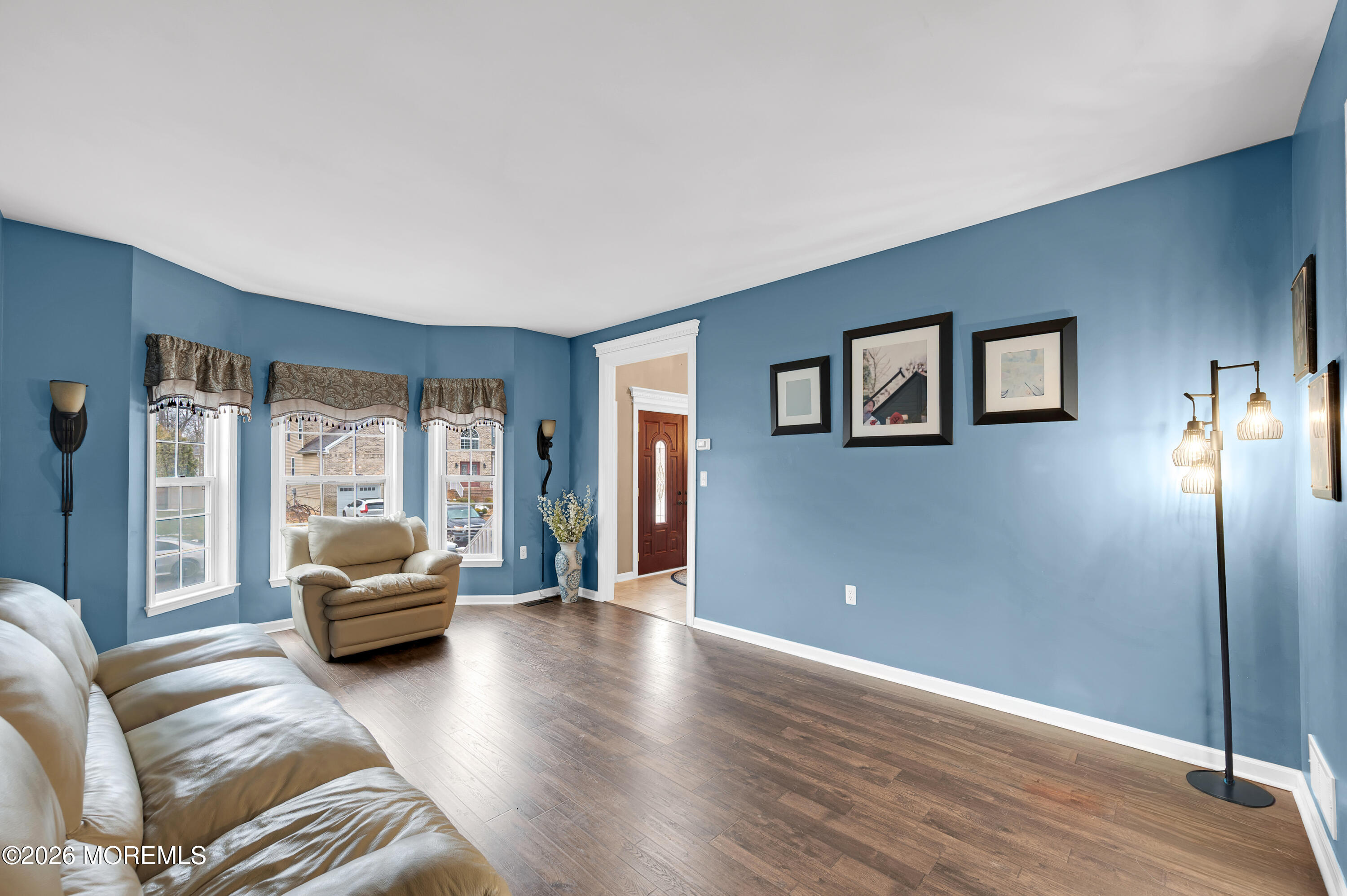 6 Reuben Court Howell, NJ 07731 - Photo 7 of 66 a living room with furniture and a large window