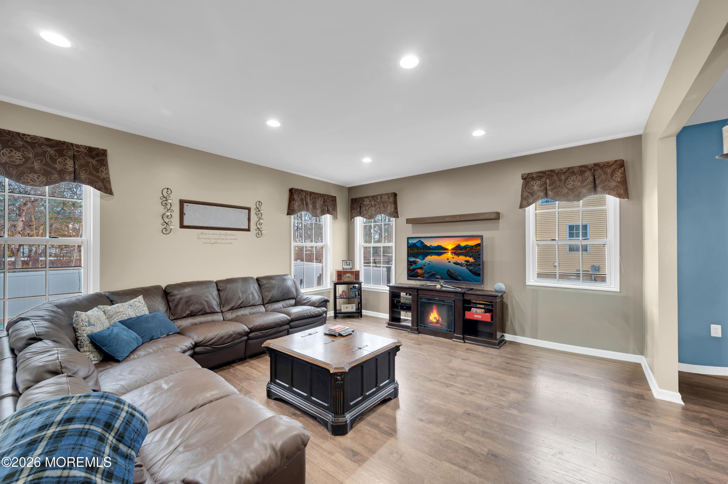 6 Reuben Court Howell, NJ 07731 - Photo 10 of 66 a living room with furniture and a flat screen tv