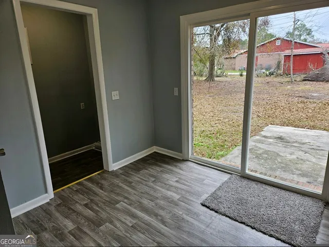 an empty room with sliding door