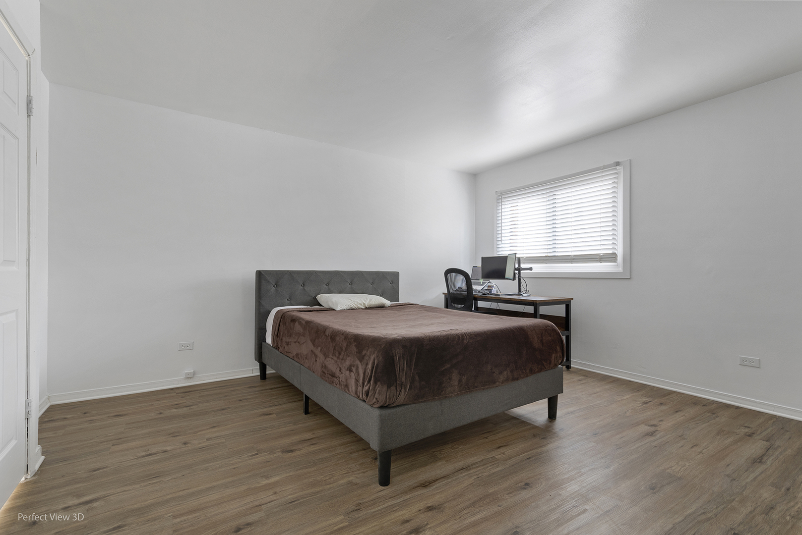 7539 North Ridge Boulevard, Unit 6 Chicago, IL 60645 - Photo 13 of 20 a bedroom with a bed and window