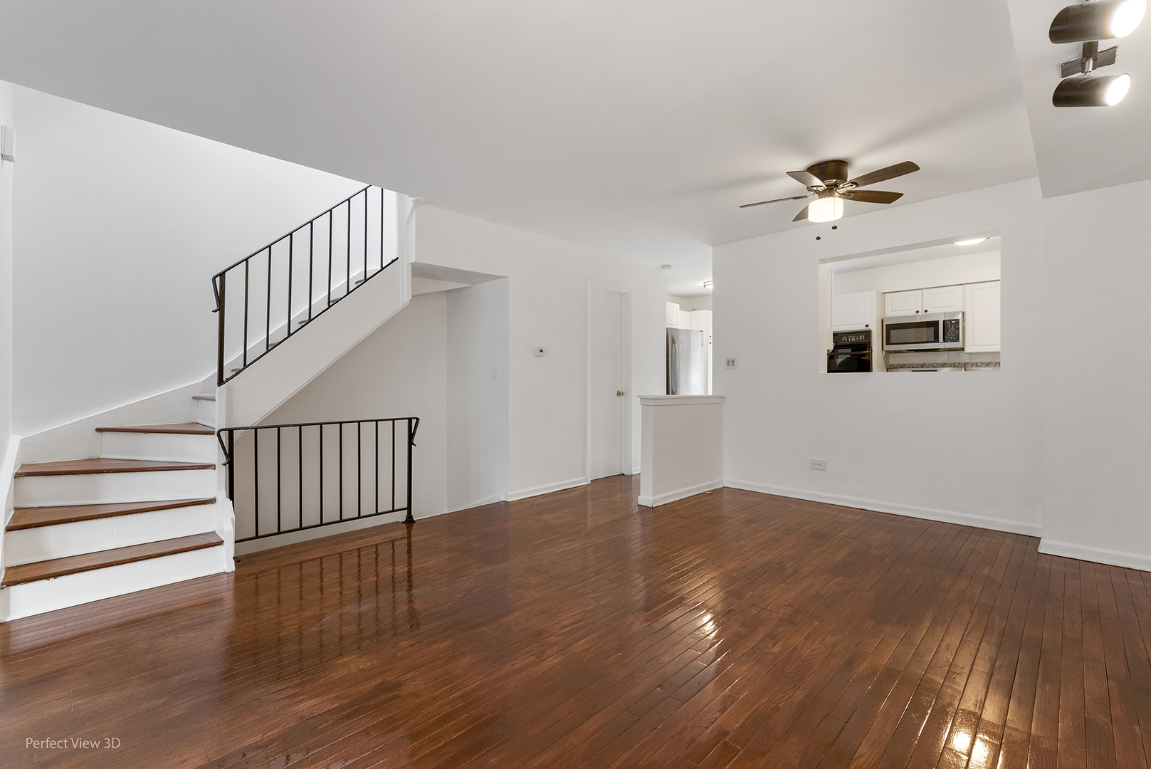 7539 North Ridge Boulevard, Unit 6 Chicago, IL 60645 - Photo 3 of 20 a view of empty room with wooden floor and fan