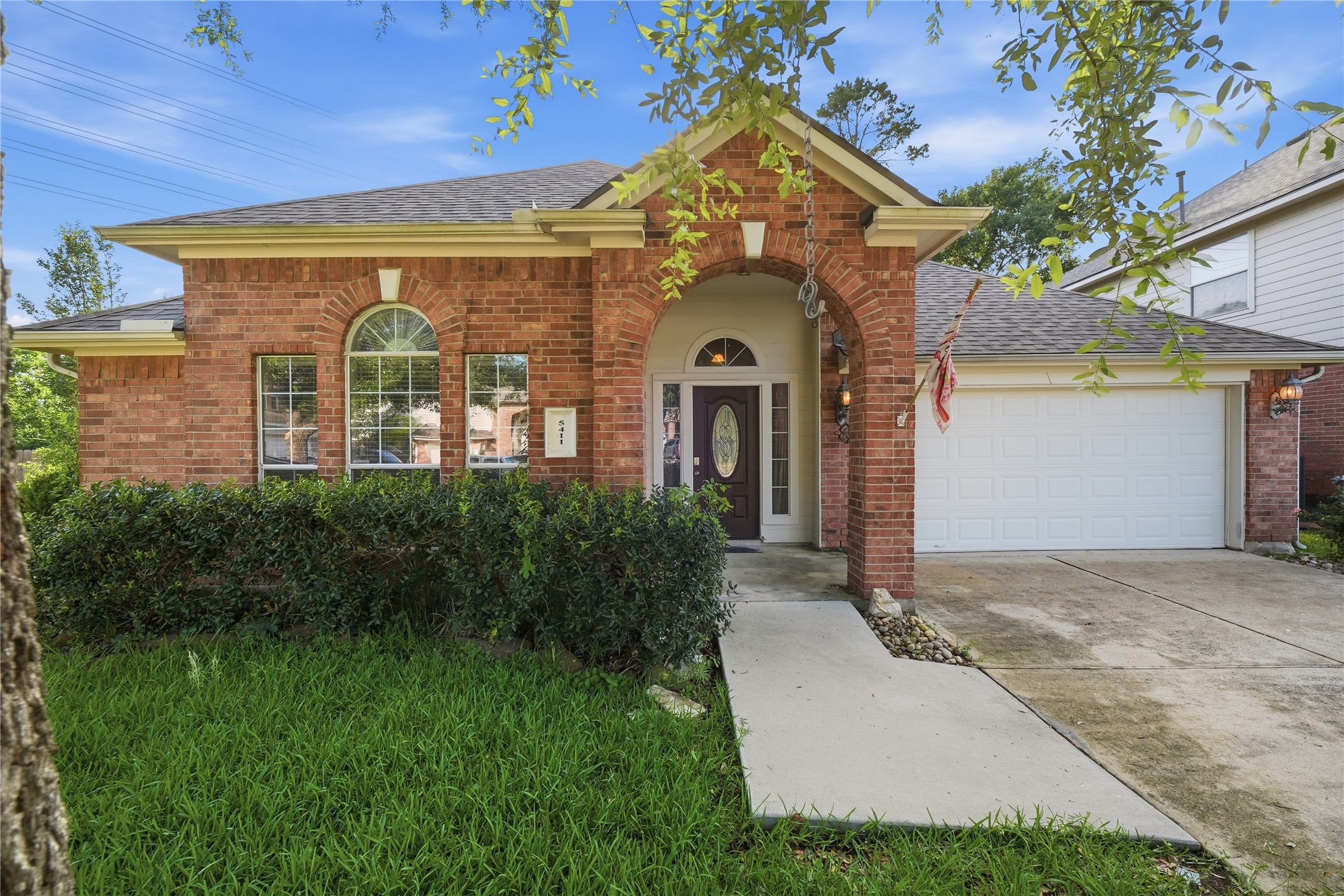 5411 Gate Canyon Court Spring, TX 77373 - Photo 1 of 33 a front view of a house with a yard