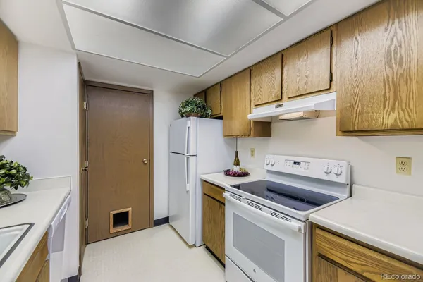 a utility room with cabinets washer and dryer