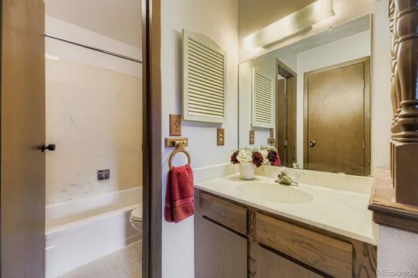 a bathroom with a bathtub and shower