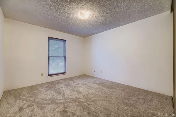 an empty room with a bathroom