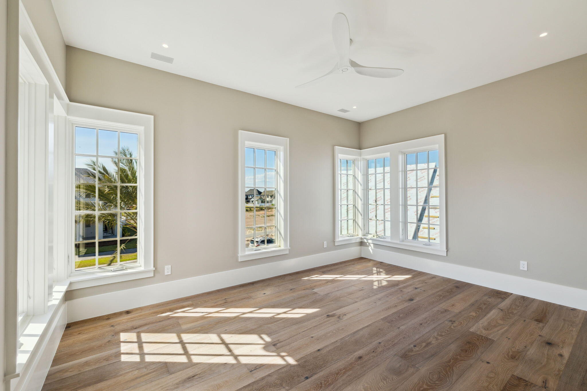 342 Windsong Dr Inlet Beach Inlet Beach, FL 32461 - Photo 58 of 87 an empty room with wooden floor and windows