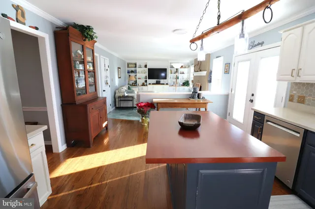 a kitchen with cabinets and window