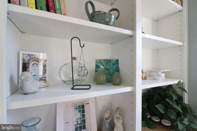 a bedroom with a bed and a tv