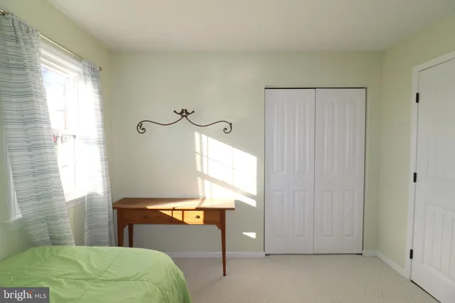 a bathroom with a toilet and a shower curtain