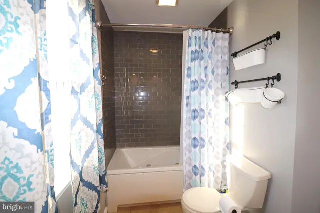 a view of a patio with iron fence