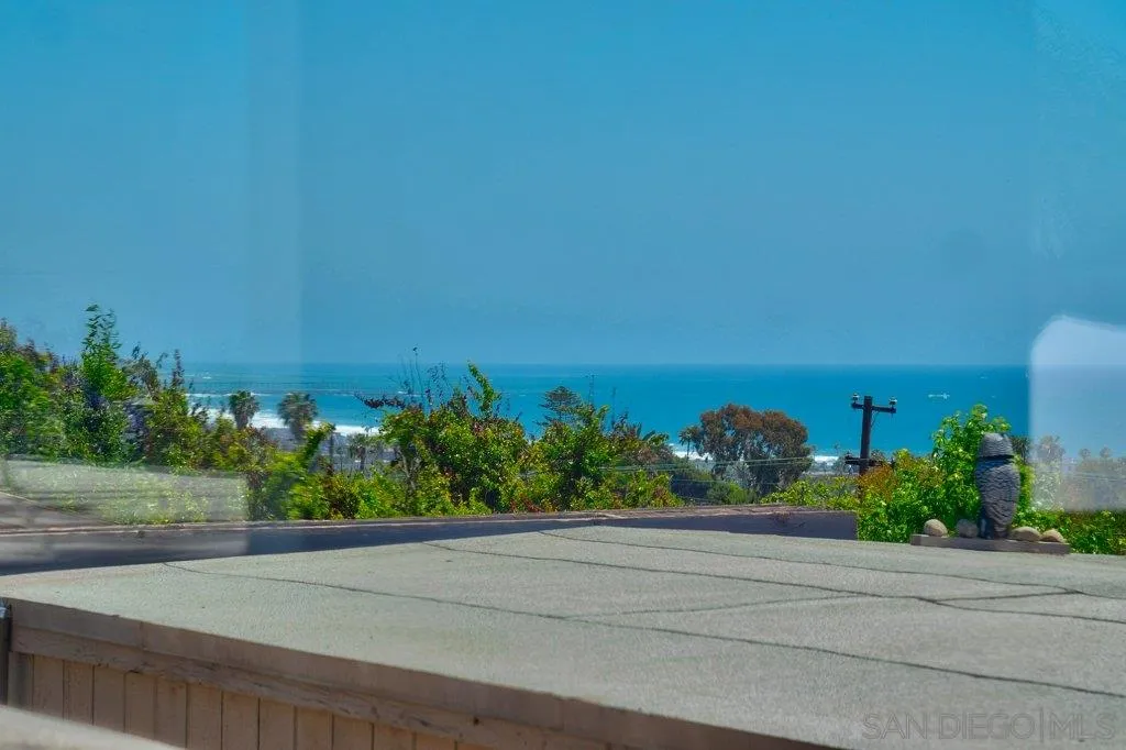 1238 Agate Street San Diego, CA 92109 - Photo 19 of 25 a view of a lake with a yard