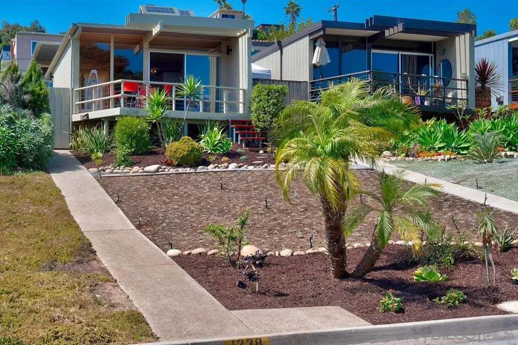 1238 Agate Street San Diego, CA 92109 - Photo 2 of 25 a view of house with outdoor space and garden