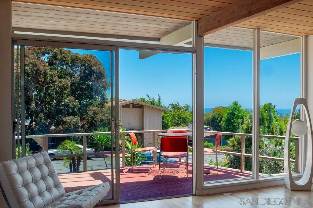 1238 Agate Street San Diego, CA 92109 - Photo 5 of 25 a view of a chair and tables in the balcony