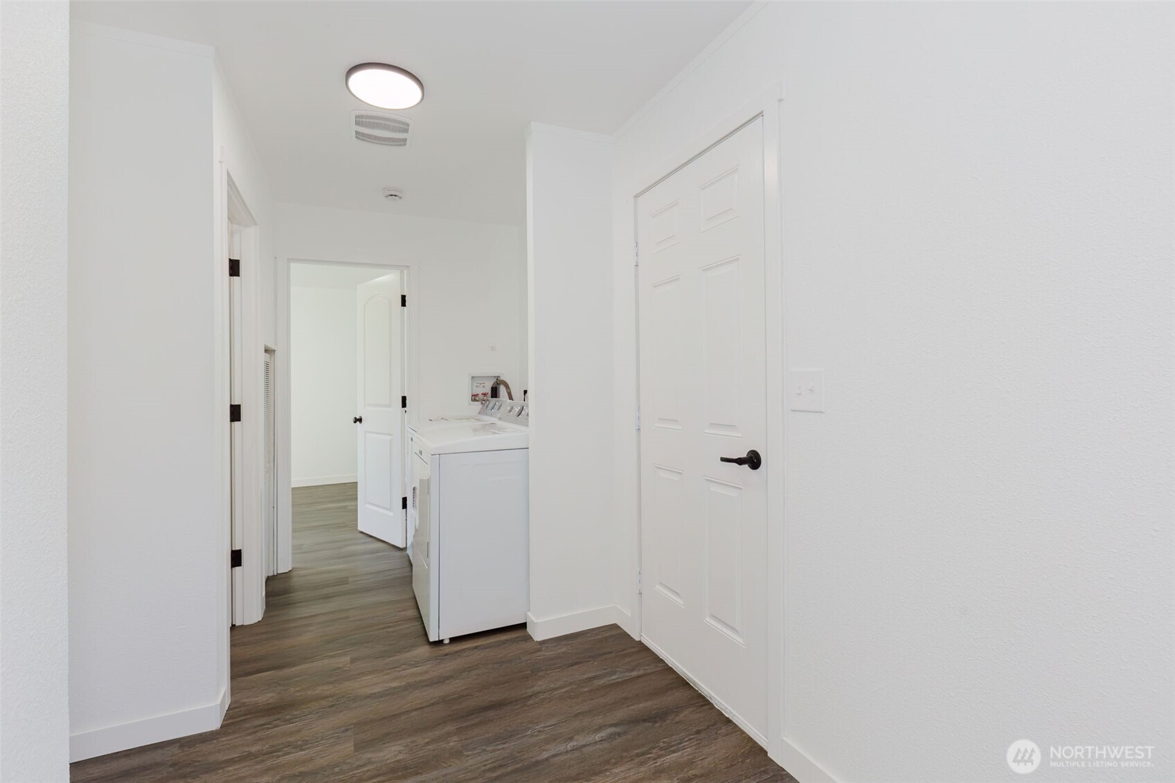 3371 Southeast Bielmeier Road, Unit 78 Port Orchard, WA 98367 - Photo 14 of 27 a view of a hallway with wooden floor