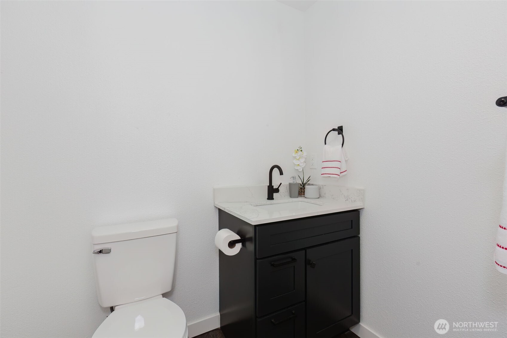 3371 Southeast Bielmeier Road, Unit 78 Port Orchard, WA 98367 - Photo 16 of 27 a bathroom with a toilet a sink and mirror