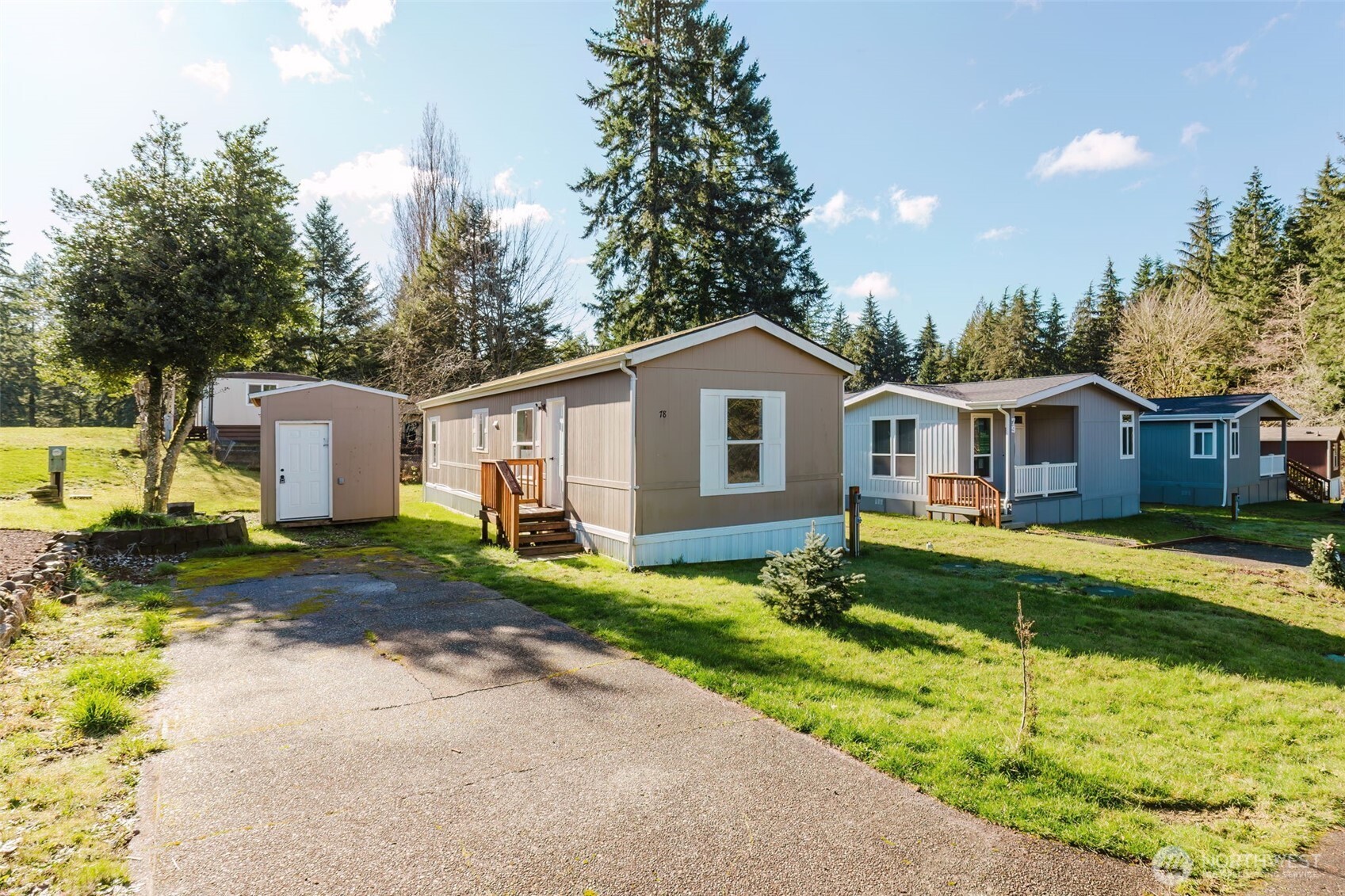 3371 Southeast Bielmeier Road, Unit 78 Port Orchard, WA 98367 - Photo 2 of 27 a front view of house with yard and green space