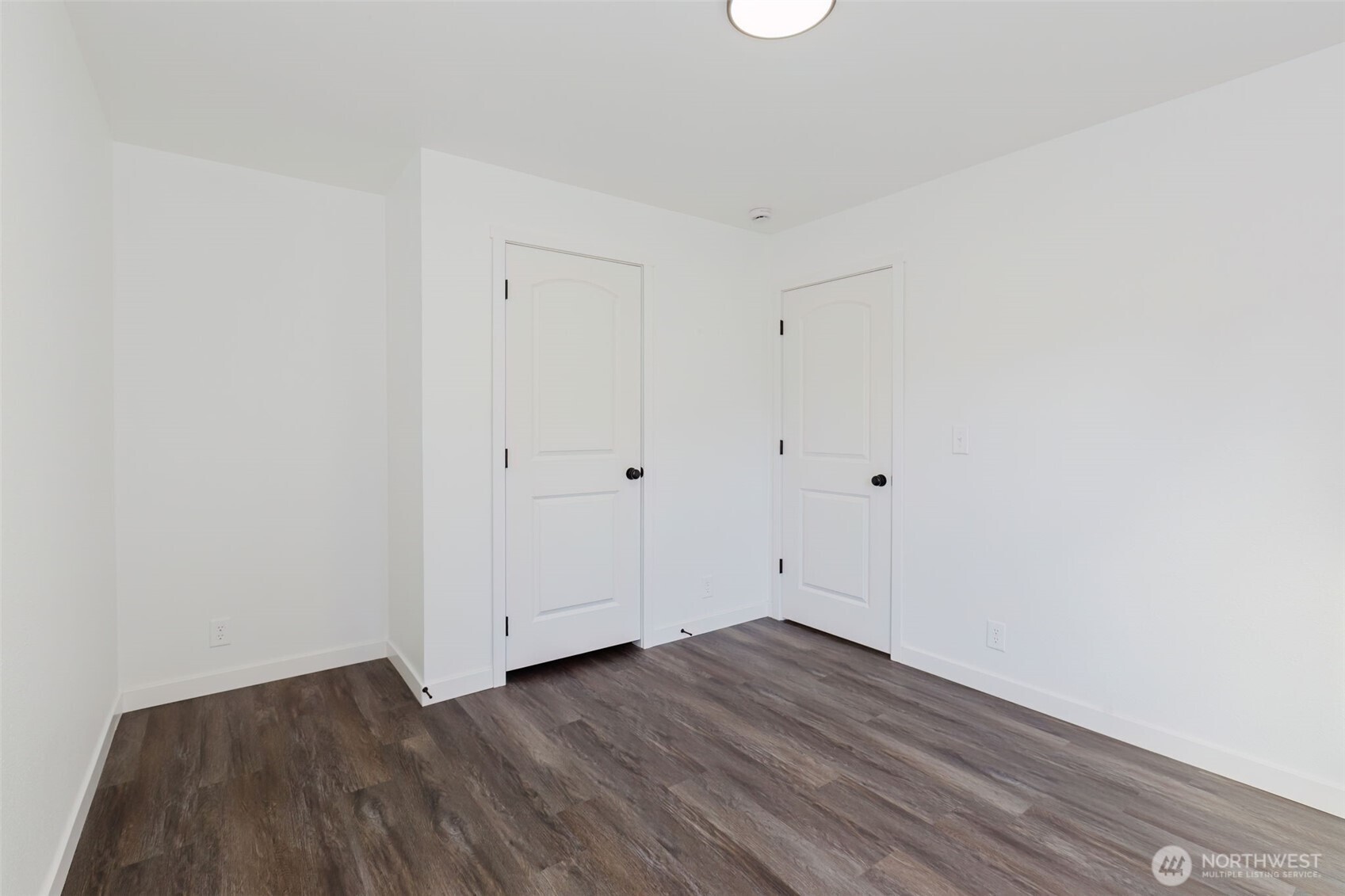 3371 Southeast Bielmeier Road, Unit 78 Port Orchard, WA 98367 - Photo 21 of 27 a view of room with wooden floor