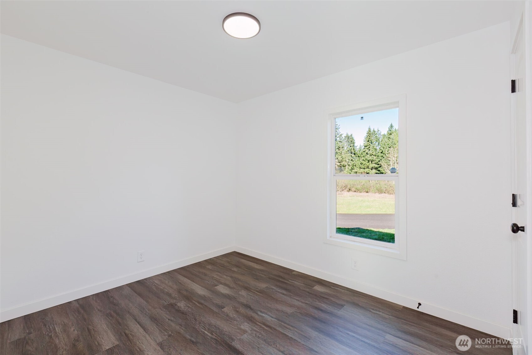 3371 Southeast Bielmeier Road, Unit 78 Port Orchard, WA 98367 - Photo 10 of 27 an empty room with a window