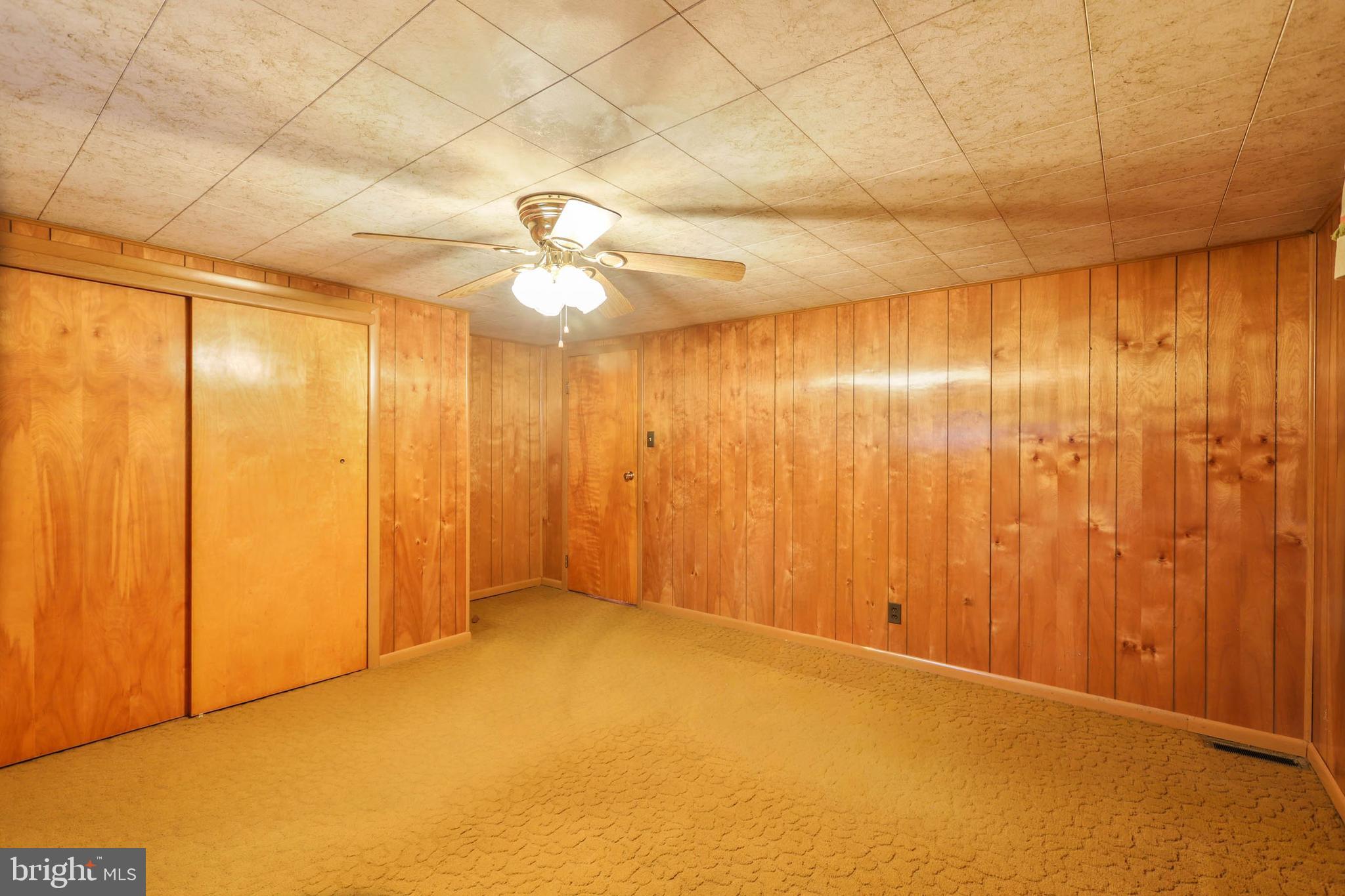 10572 Upper Strasburg Road Upperstrasburg, PA 17265 - Photo 19 of 27 wooden floor in an empty room with a window