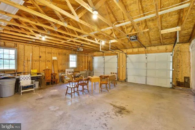 a view of a livingroom with furniture and a window