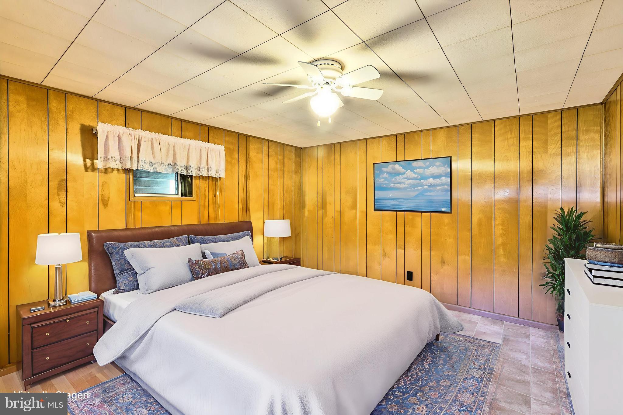 10572 Upper Strasburg Road Upperstrasburg, PA 17265 - Photo 10 of 27 a bedroom with a bed and a chandelier