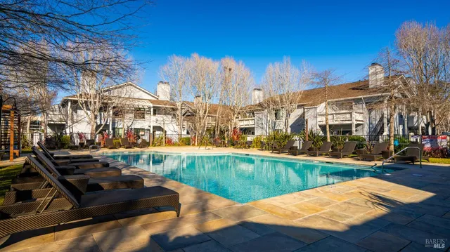 a view of a swimming pool with a patio