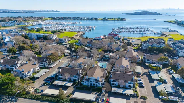 an aerial view of a with a swimming pool outdoor seating and mountain view